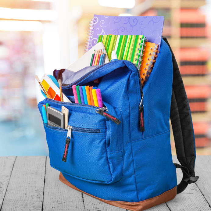 a blue backpack filled with school supplies